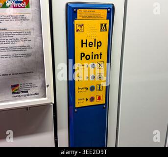 A public help point information console for metro transport assistance with tactile braille buttons and icons Newcastle upon Tyne Metro Stock Photo