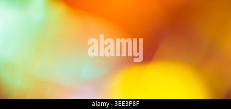Vibrant abstract background with blurred orange yellow and mint green gradient and soft bokeh Stock Photo