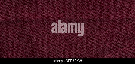 Dark burgundy wine knitted wool fabric texture with diagonal weave pattern Stock Photo