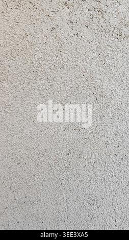 Full frame shot on coarse white stucco wall. Fine speckles, rough texture with shadows and subtle gradients. Commercial applications include backgroun Stock Photo