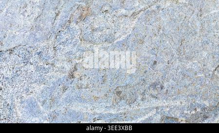 Detailed full frame shot showcases intricate patterns in blue rock. Neutral lighting emphasizes textures, suitable for backgrounds and designs. Use fo Stock Photo