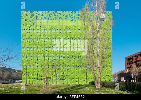 Lyon, France - March 19, 2026: The Euronews Headquarters by Jakob + MacFarlane, featuring a vibrant green perforated facade and large circular voids Stock Photo