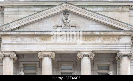 Classical stone pediment and Ionic columns on the Lillian Massey Building facade with carved Department of Household Science inscription. Stock Photo