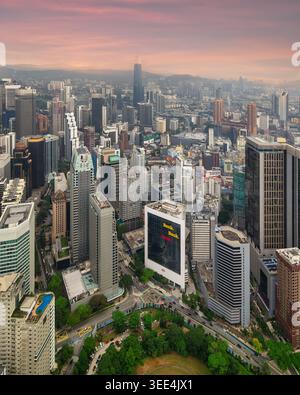 Aerial view of a modern high-rise building with a telecommunications ...