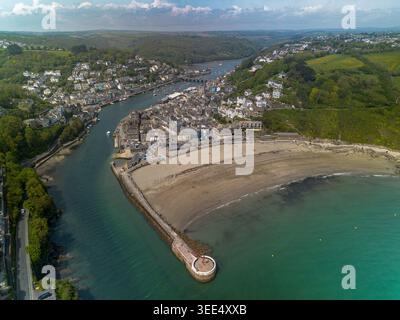 High aerial view over Looe harbour, Banjo Pier and town, Cornwall, looking inland from the sea Stock Photo
