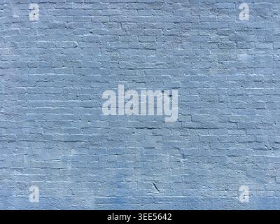 A view of a blue painted brick wall, as a background. Stock Photo