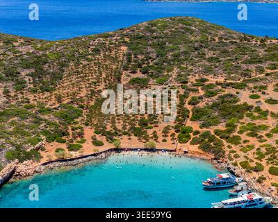 Scenic high angle view of a Mediterranean beach with clear blue water and hills Stock Photo