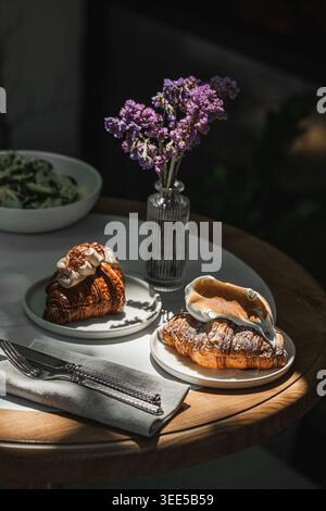 Pastries with berries and cream on cafe table Stock Photo