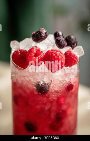 Berry cocktail with ice and fresh mixed berries Stock Photo