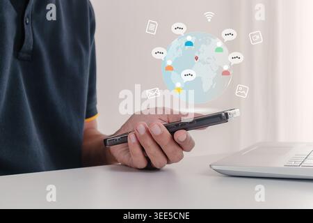 A man using his smartphone to communicate and share files with people in different countries. Globalization concept. Stock Photo