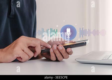 A man using an AI voice chat assistant on his smartphone Stock Photo