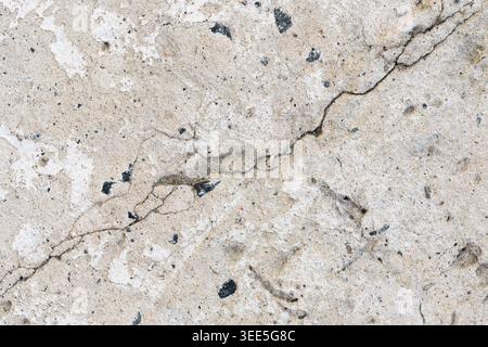 Rough industrial concrete surface with deep structural crack texture Stock Photo