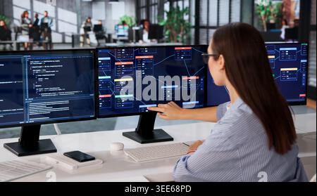 Woman Focused On Visual Programming Using Node-based No Code Software. Stock Photo