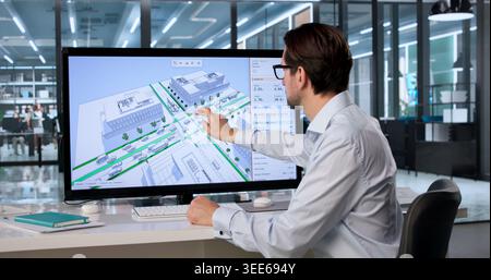 Experienced Civil Engineer Uses 3D Software On Computer Analyzing City Bike Lane Traffic Flow. Stock Photo