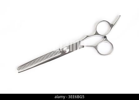 Professional thinning hair scissors isolated on white background . Stock Photo