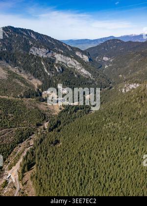 Aerial view of the Tatra Mountains with a winding road cutting through ...