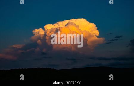 Large Thunderhead Clears Out Of The Shenandoah Area At Sunset in summer Stock Photo