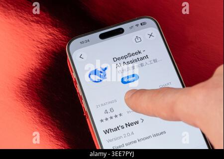 New York, USA - May 5, 2026: Open Deepseek AI app on iphone smartphone screen close up view on red foil background Stock Photo