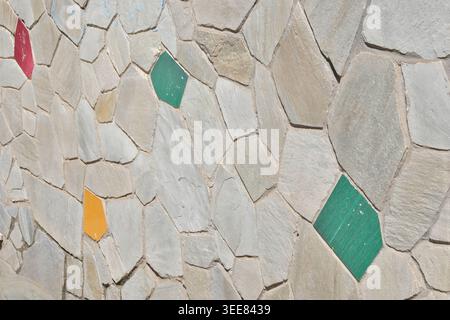 TEXTURE BACKGROUND OF A WALL WITH SOME COLORED BRICKS Stock Photo
