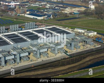 Aerial view of the Google data center featuring large industrial buildings, cooling systems, and solar panels in Winschoten, Groningen, Netherlands. Stock Photo