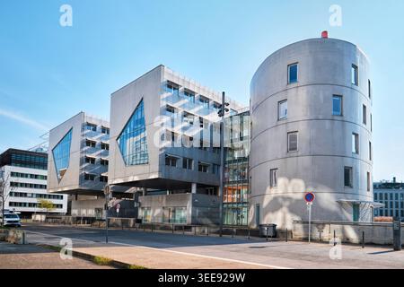 Lyon, France - March 19, 2026: Headquarters of Le Progres newspaper in Confluence, featuring a renovated industrial silo and modern geometric facade. Stock Photo