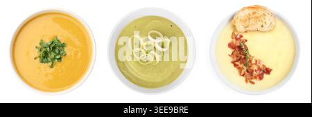 Different tasty soups in bowls isolated on white, set. Top view Stock Photo