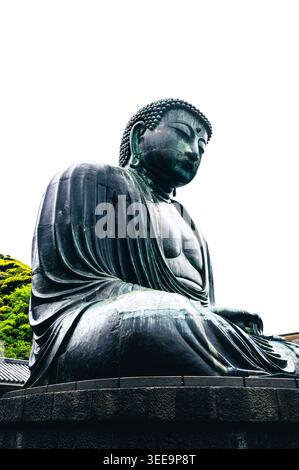 The Great Buddha of Kamakura (Daibutsu) with stone lantern in
