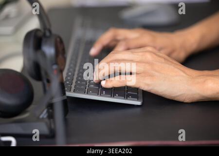 Close up of woman hands typing on computer keyboard Stock Photo