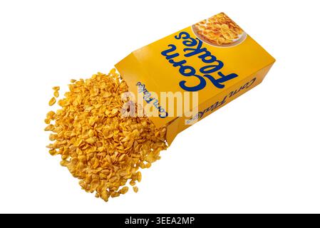 Yellow cereal box mockup with crunchy golden corn flakes scattered isolated on white, clipping path included Stock Photo
