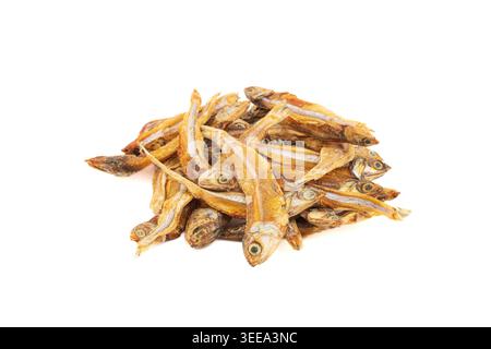 Pile of dried sardines often used as dog and cat treats photographed on a white background. Stock Photo