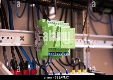 Shelly Pro Dimmer 2PM modules in a domestic fuse box. Close-up of a smart home system. Electronic product in a residential context. Stock Photo