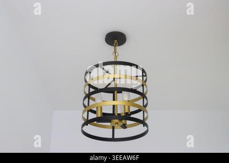 Indoor pendant electric lamp fixed a white ceiling Stock Photo