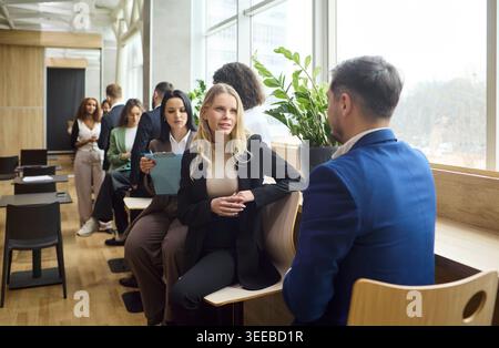 Professional Interview or Networking Talk Between Colleagues in Bright Modern Office Stock Photo