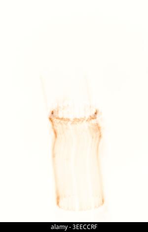 Ethereal cylindrical form created using long exposure technique on a light background, suggesting movement and energy. Stock Photo