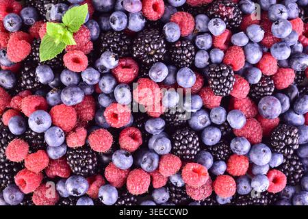 Background of raspberries, blueberries, blackberries. Flat lei. Stock Photo