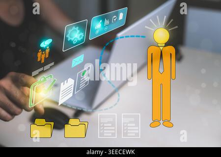 Man developing business ideas using artificial intelligence technology, classifying documentation, data forms, and company statistics on a laptop at h Stock Photo