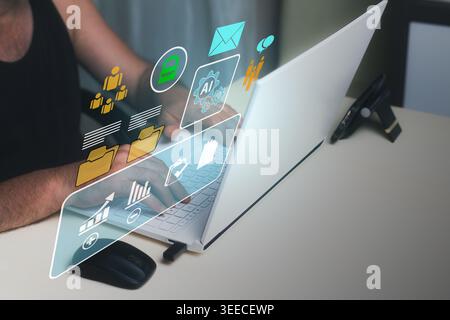 Businessman working with artificial intelligence technology, managing data and statistics, filling out forms and company documents on a laptop at home Stock Photo