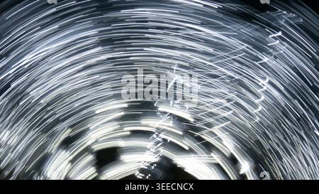 Abstract Long Exposure Light Trails Spinning Vortex Movement Stock Photo