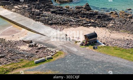 Big Sand Beach Gairloch Scotland the Fire and Steam Sauna near the slipway and rocks Stock Photo