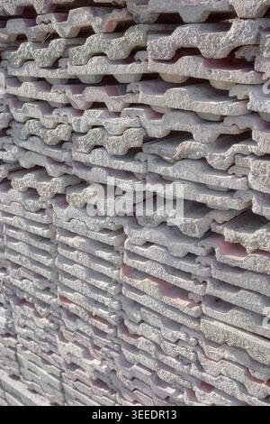 Old roof tiles arranged in rows, selective focus, abstract background. Stock Photo