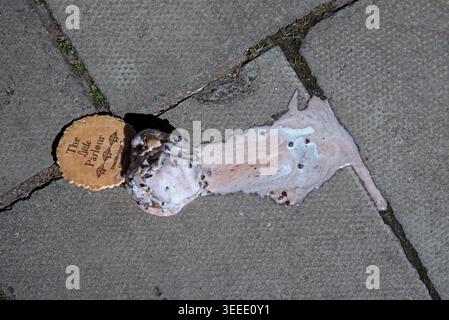 Ice cream cone dropped on the pavement in Stockbridge, Edinburgh, Scotland, UK. Stock Photo