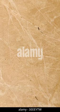 Neutral beige marble background in full frame. Soft studio lighting emphasizes veining and natural stone texture. Ideal for product mockups in wellnes Stock Photo