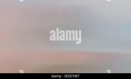 Minimalist setup showcases pastel pink, gray color gradient. Soft lighting enhances fine polished surface texture. Background ideal for technology, he Stock Photo