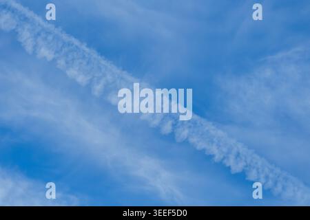 Soft wispy cirrus clouds move across a clear blue morning sky, showing classic high‑level cloud patterns. Blayney, NSW, Australia. Stock Photo