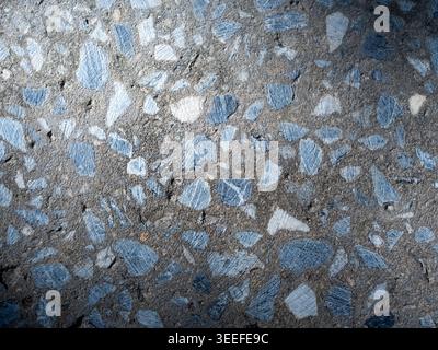 Concrete texture background with exposed aggregate stones and rough surface pattern. Natural gray material backdrop for construction, architecture, in Stock Photo