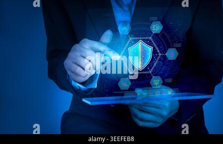 Businessman using tablet with AI cybersecurity interface and digital shield. Smart protection, data security, cyber defense, network protection, threa Stock Photo