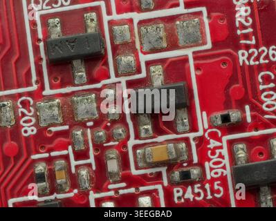 Close-Up Detail of Red Circuit Board with IC and SMD Parts Stock Photo