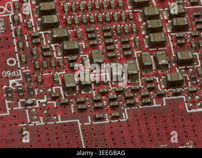 Close-Up Detail of Red Circuit Board with IC and SMD Parts Stock Photo
