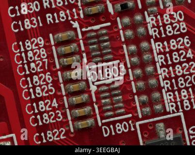 Close-Up Detail of Red Circuit Board with IC and SMD Parts Stock Photo