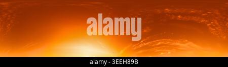 Sunset sky panorama shows a vibrant orange atmosphere with wispy clouds across the wide horizon for 360 background use Stock Photo